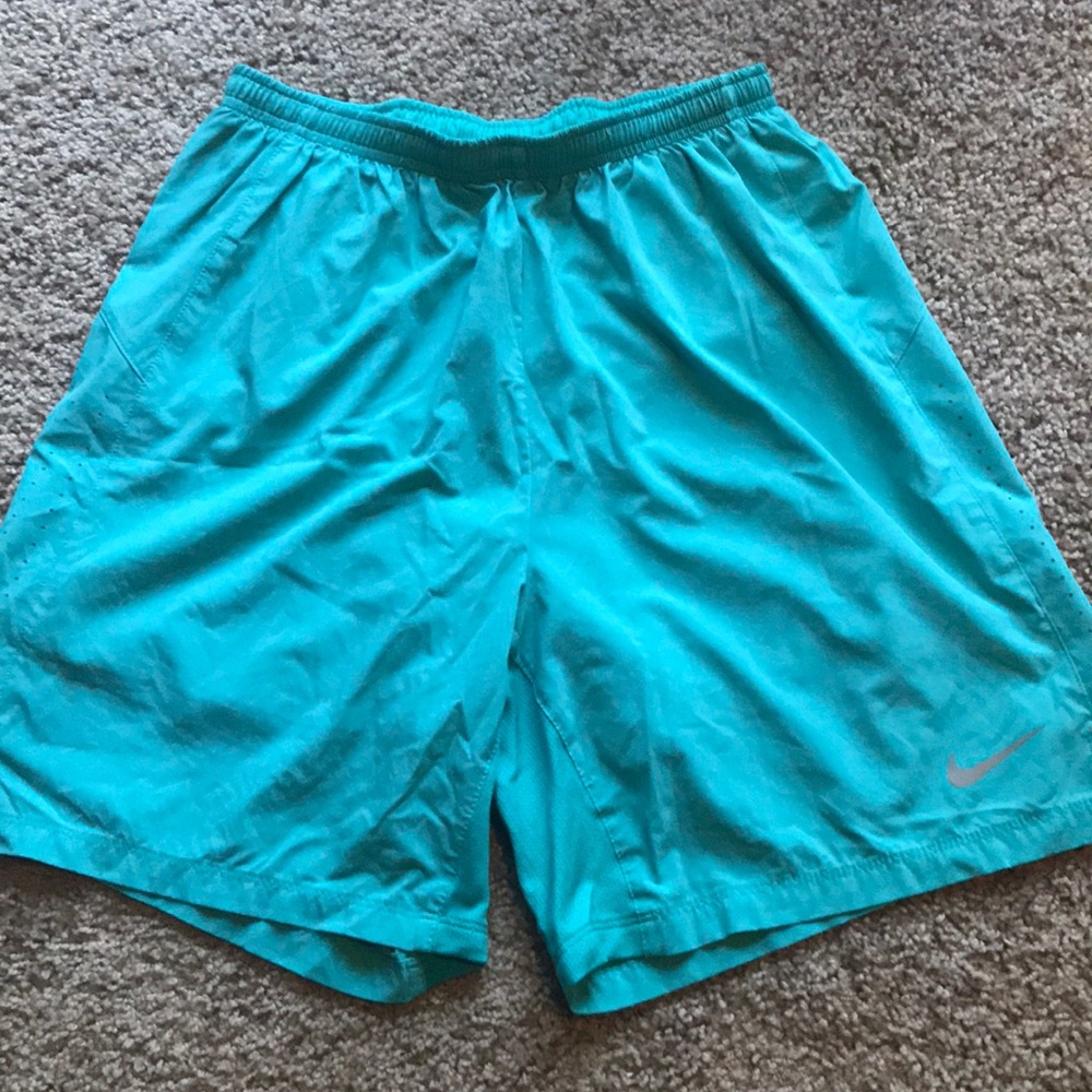 Teal Nike running shorts
